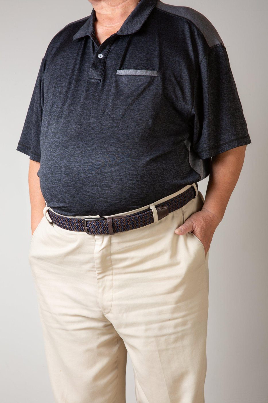 Man in a polo and khakis wearing a QUALIBELT braided stretch belt